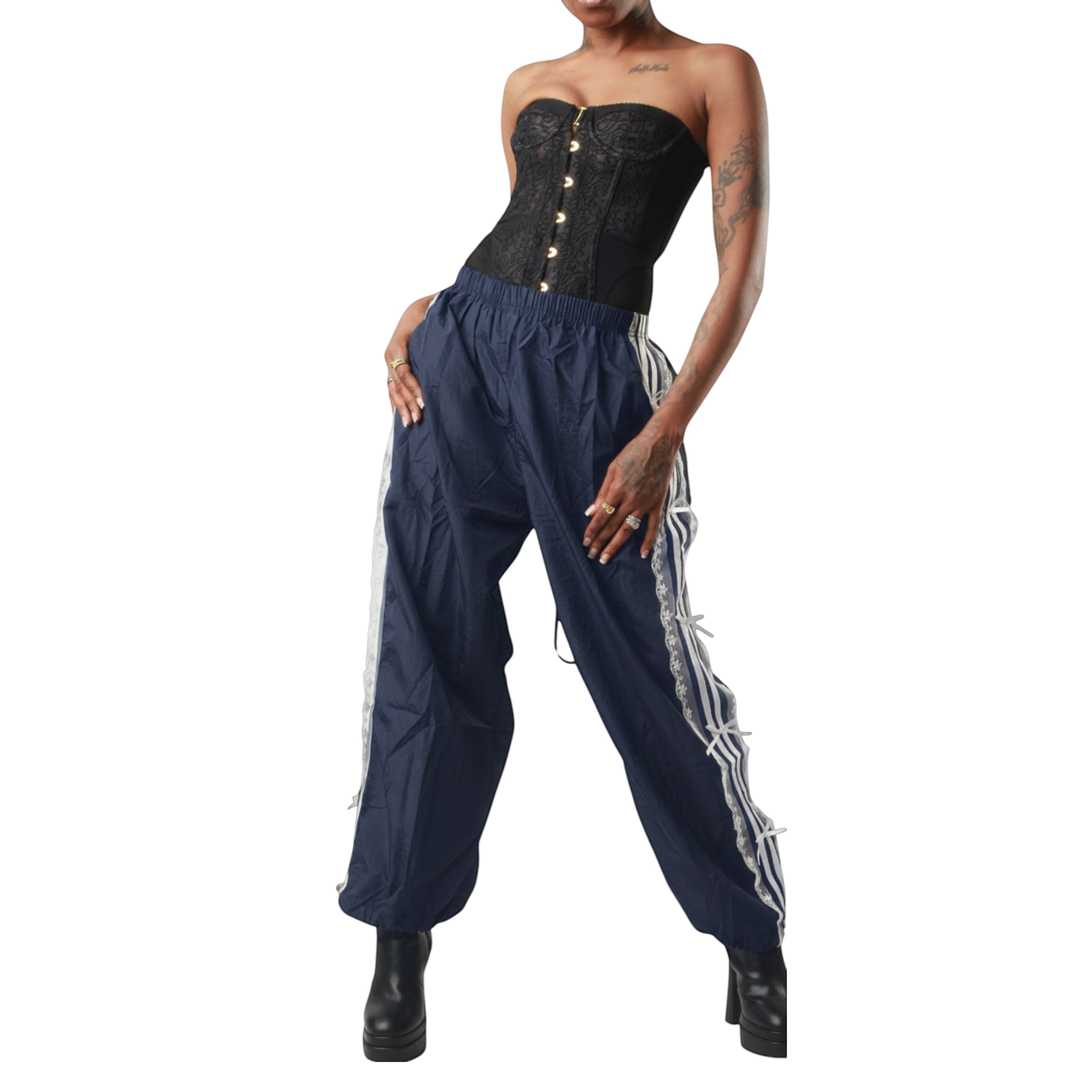 Sweet Plus Savage navy blue track pants with white side stripes and lace trim detail, elastic waistband, and adjustable cuffs.